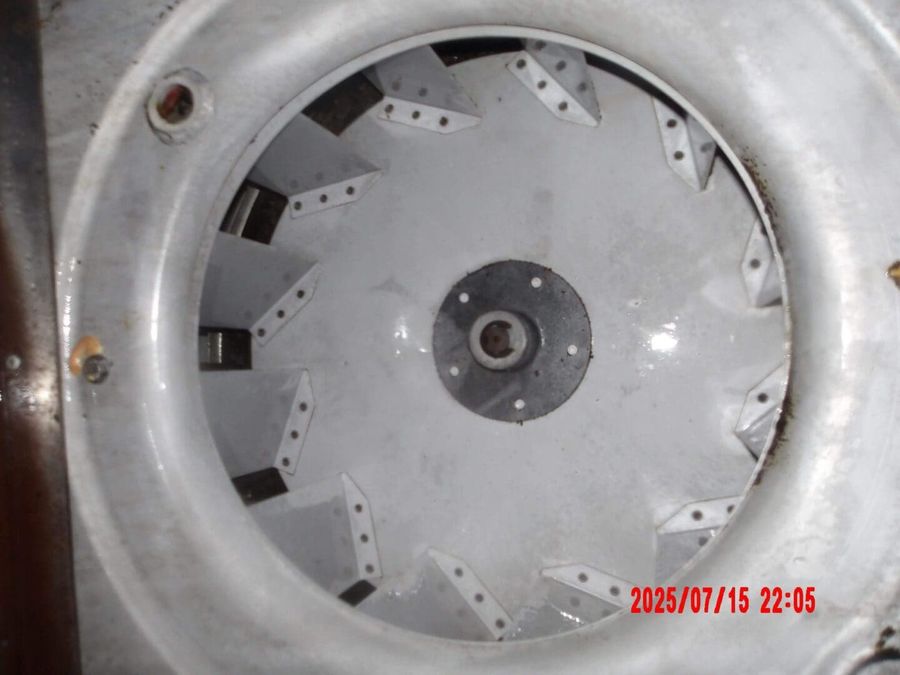 The same rooftop fan cleaned to bare metal