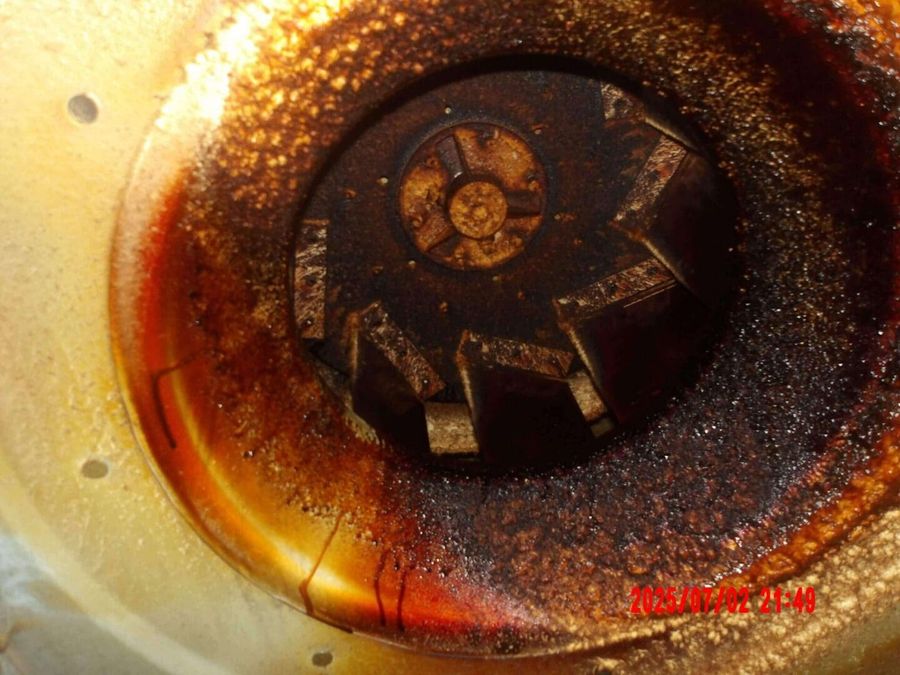Grease-caked fan wheel before cleaning by Oregon Hood Cleaning