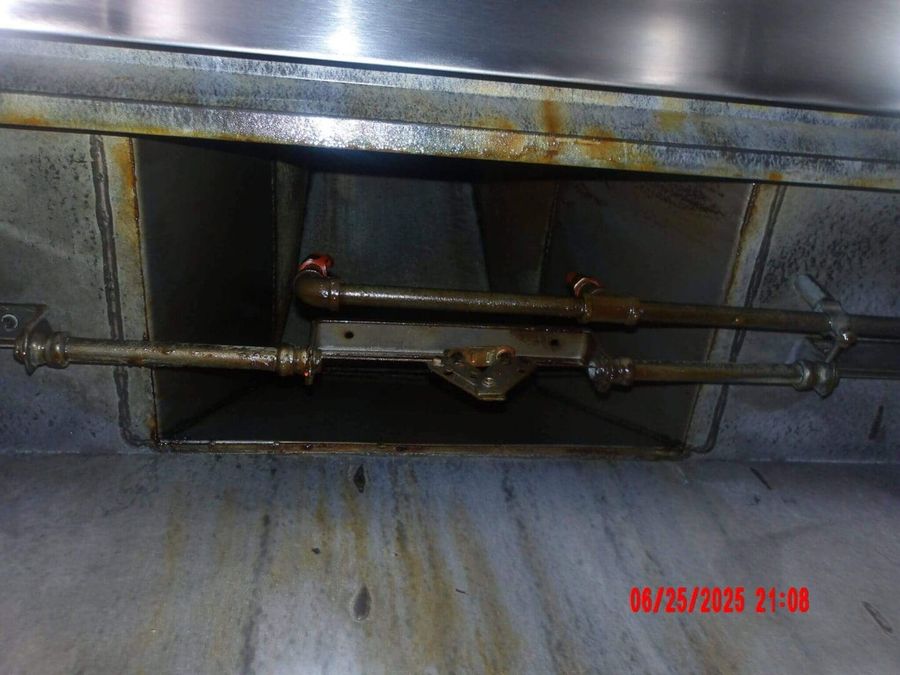 Grease-caked duct riser before cleaning by Oregon Hood Cleaning